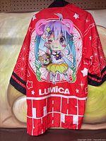 Back view showing anime mascot graphic and Lumica logo