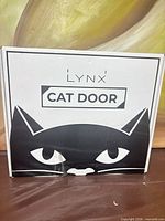 sealed box front showing Lynx Cat Door branding