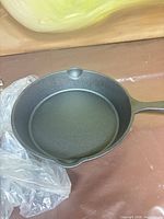 Interior of skillet showing clean cooking surface and pour spout