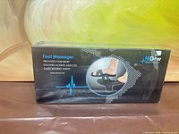 Front of sealed HiDow AcuSlipper retail box
