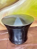 Full view of black ice bucket with lid