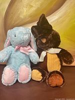 Both plush rabbits side by side