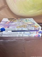Spines of three Re:ZERO manga volumes 1,3,5