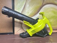 Left side view of Ryobi 18V leaf blower showing tube and housing