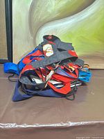 Pile of mixed reusable bags on table