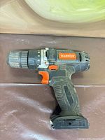 Left side view of Warrior 12V drill/driver showing keyless chuck and trigger