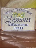 Front view of tin sign showing text and design