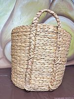 full view of woven seagrass basket showing shape and handles