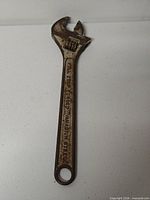 Full view of 10-inch adjustable wrench showing overall size and hanging hole