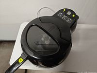 Top view of Actifry air fryer showing lid, handle and overall body