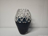 Front view of blue vase with clear crown rim