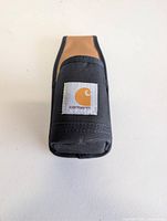 Front view of canvas pouch with Carhartt logo