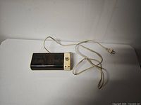 Full view of GE charger with attached cord