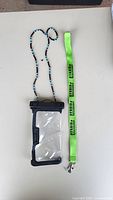 front view of phone pouch with both lanyards
