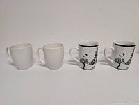 Front view of four mugs in a row