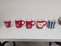 Front view of all five mugs lined up