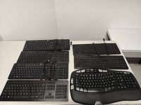 Overview of all eight keyboards on table