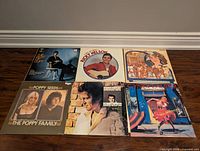 Six album covers laid out, overview of entire lot