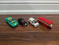 Front angled view of four die-cast vehicles in a row