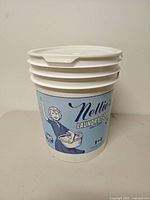Front view showing Nellie's Laundry Soda label, bucket shape and lid