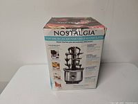 Retail box showing Nostalgia chocolate fountain product information