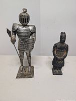Front view of both figurines side by side on table