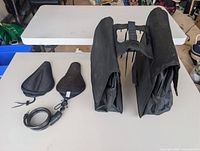 Pair of panniers, two saddle covers, cable lock overview