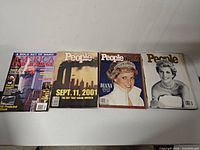 All four People magazines laid flat showing covers