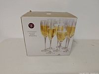 Front of retail box showing champagne flutes image and label