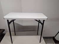 Front view of folding table standing