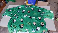 Full view of green Harry Potter Oodie laid flat showing size and graphics
