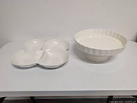 Top view of divided tray and pedestal cake stand side by side on table