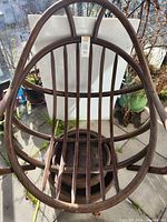 Full view of bamboo chair showing frame, base, and slat seat