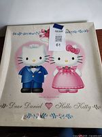 Front cover showing Dear Daniel and Hello Kitty graphic on velvet board