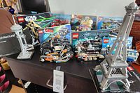 Group view of all nine assembled LEGO sets and manuals