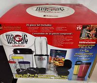 Front of sealed Magic Bullet Deluxe box showing product image and content list