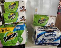 All packaged paper towels and napkins visible together