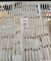 Large quantity of rectangular crystal prism pieces laid out, showing pins