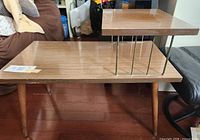 Full view of two-tier side table showing overall design and condition