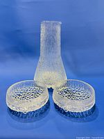 Vase and two bowls front view