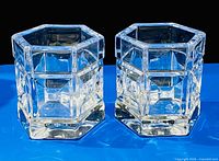 Front view of both hexagonal crystal candle holders upright