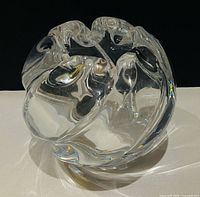 Overall view of clear Orrefors art glass rose bowl showing sculptural swirl form