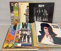 Stack of LPs showing KISS, Bowie, Trevor Rabin and others