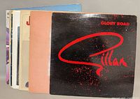 Front view of stacked LPs showing Gillan Glory Road cover and partial spines of others