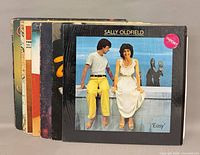 Stack of LP records with Sally Oldfield Easy frontmost