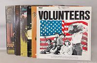 Stack of seven LP records with Volunteers cover visible at front