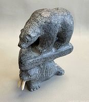 Front angled view showing bear atop walrus sculpture