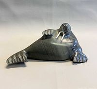 Front view of signed soapstone walrus with tusks