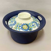 Full view of casserole with lid showing exterior colour and floral design