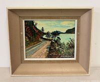 Overall view of framed painting showing artwork, signature, and frame style